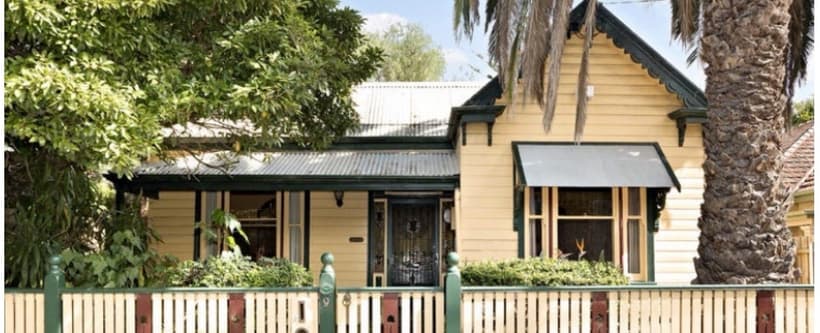Heritage weatherboard home before painting, tired cream paintwork