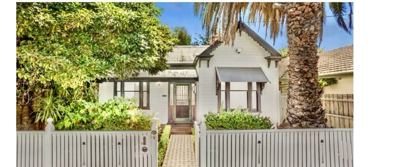 Same heritage home after painting, crisp fresh finish